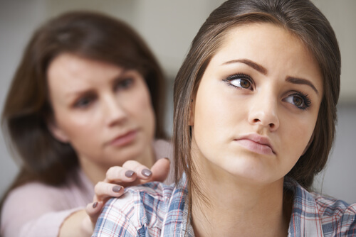 Mother trying to help her daughter