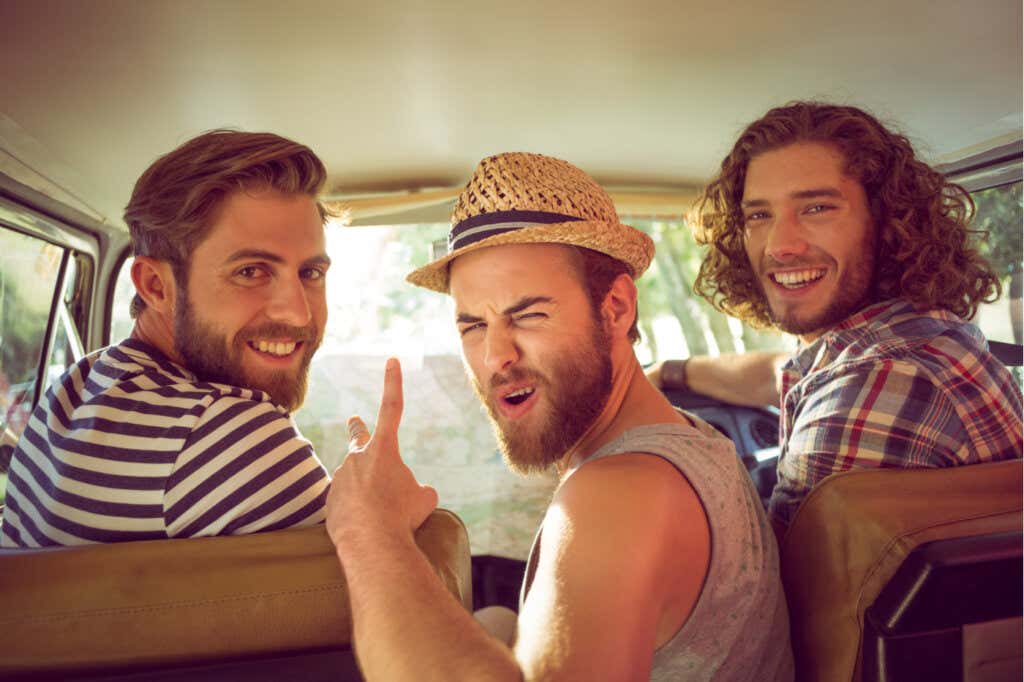 Three friends adult men going on a road trip.