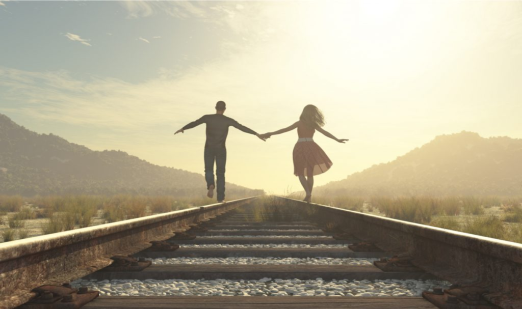 couple holding hands via train thinking of sacrificing for others