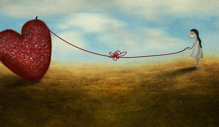 Chica unido a un corazón con un hilo fruto del amor no correspondido