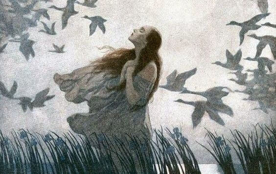 Mujer rrdeada de pajaros