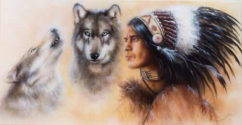 Dos lobos junto a un indio