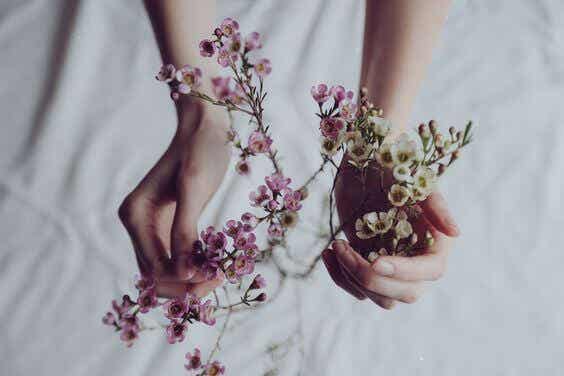 Hands with flowers to give thanks