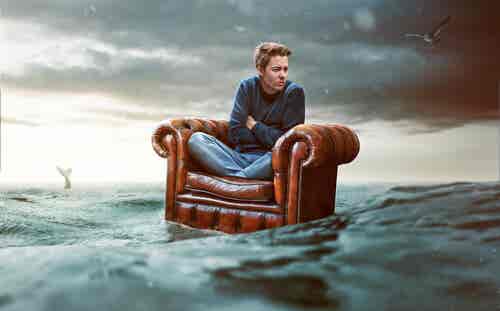 castaway on an armchair putting faith in the law of attraction