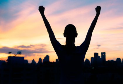 A triumphant man, showing self-efficacy.