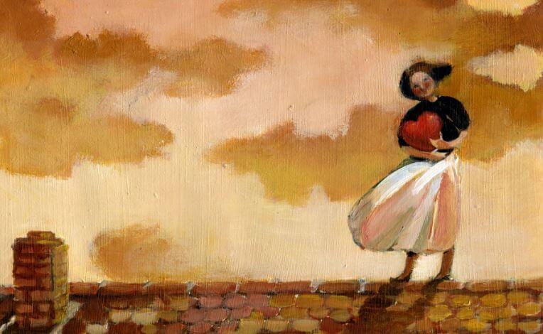 Mujer en un tejado con un corazón en las manos