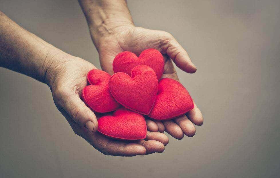 Hand holding hearts