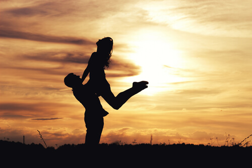 Happy couple at sunset