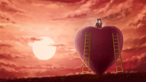 PAreja sobre un corazón mostrando amor