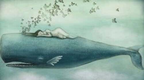 Mujer sobre una ballena