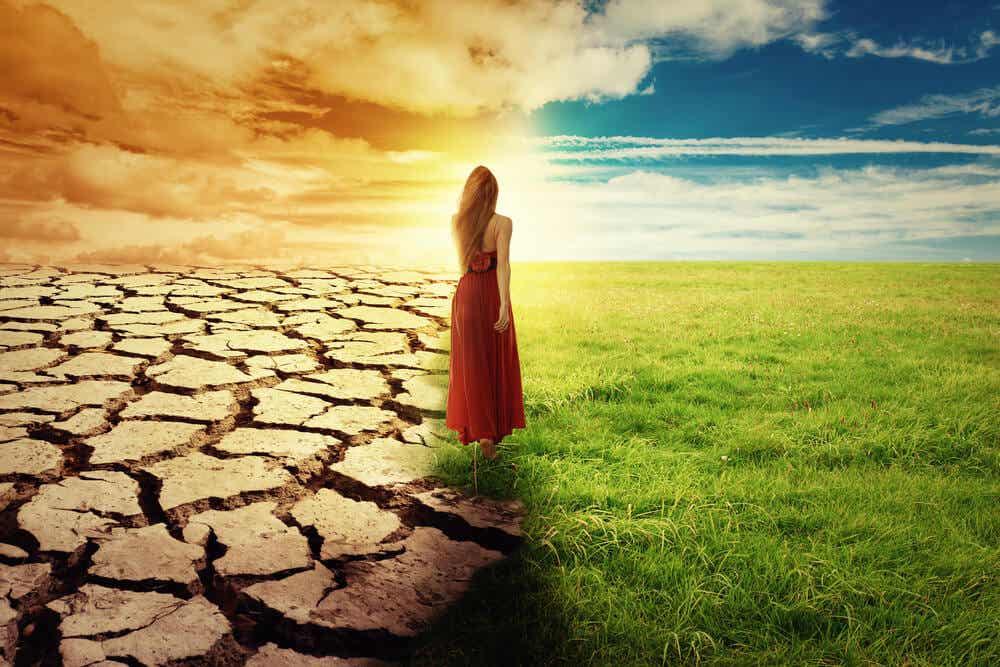 woman between dry and fertile land