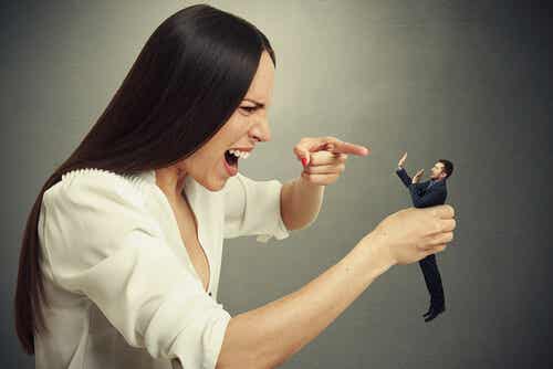 A woman yelling at a tiny man