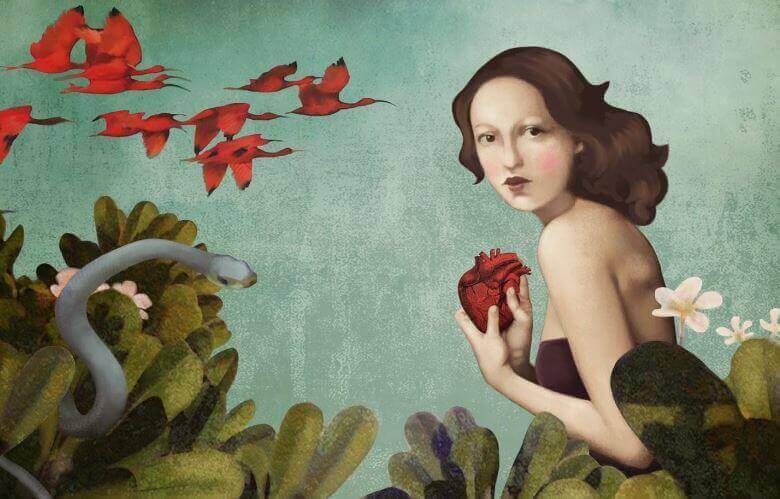 Femme avec un coeur dans sa main symbolisant l'amour