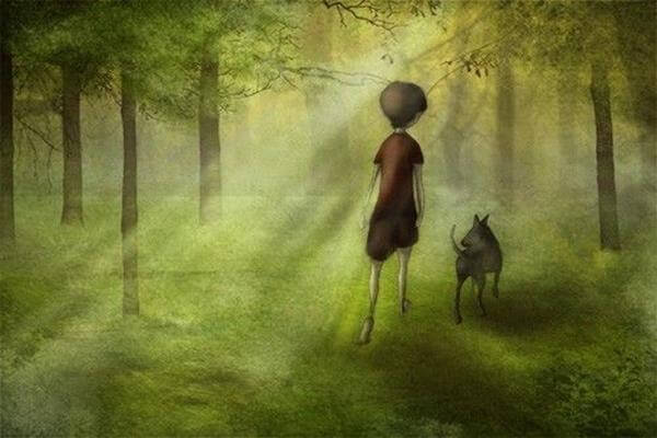niño paseando por un bosque con su perro (2)
