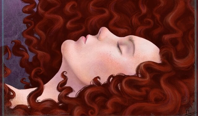 a sleeping woman with long curly red hair