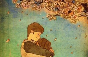 Pareja dándose un abrazo bajo el árbol