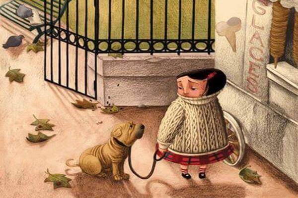 Niña en un parque con un perro