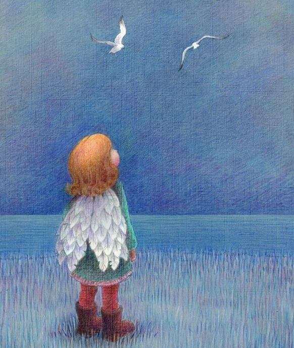 niño con alas mirando el cielo