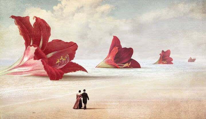 couple walking before giant flowers