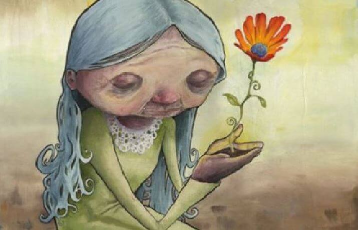 Mujer con una flor en sus manos