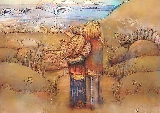 Pareja abrazada mirando al horizonte