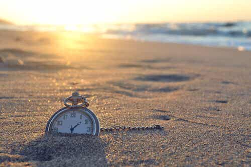 Clock buried in the sand