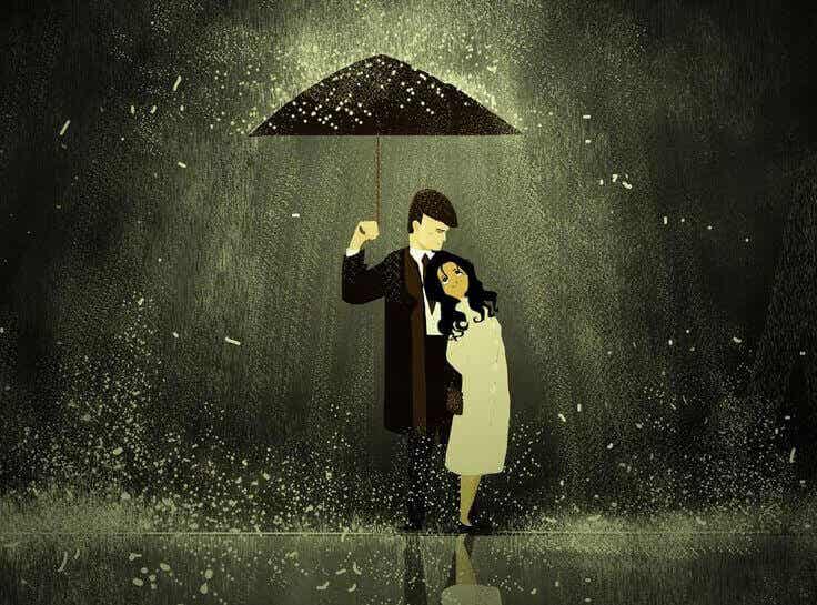 Hombre y mujer debajo de un paraguas