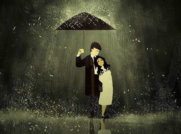 Hombre y mujer debajo de un paraguas