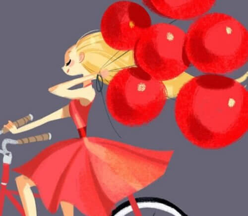 Mujer en bicicleta llevando globos rojos