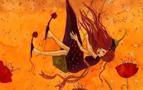 Chica montada en un columpio disfrutando de sí misma