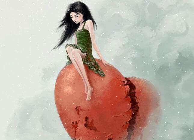 Mujer sentada sobre corazón