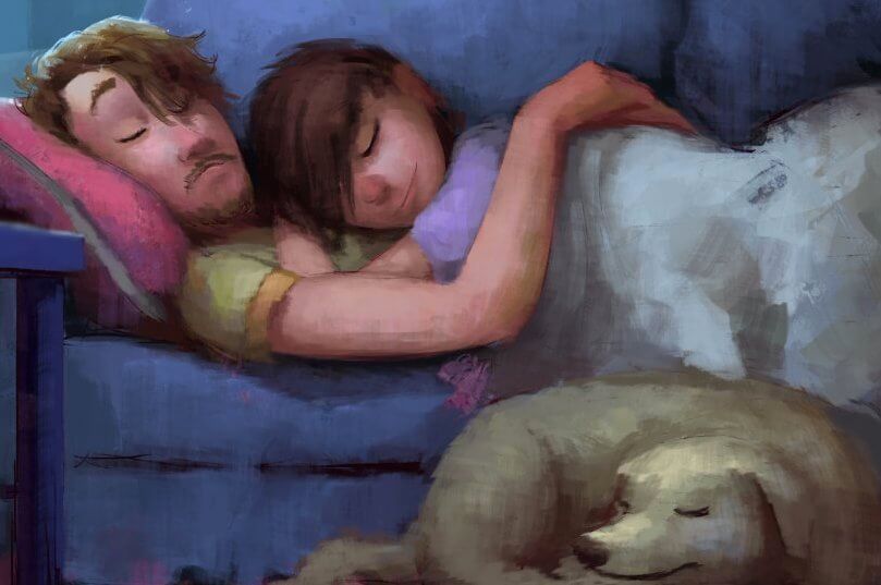 pareja abrazada sobre un sofá con perro