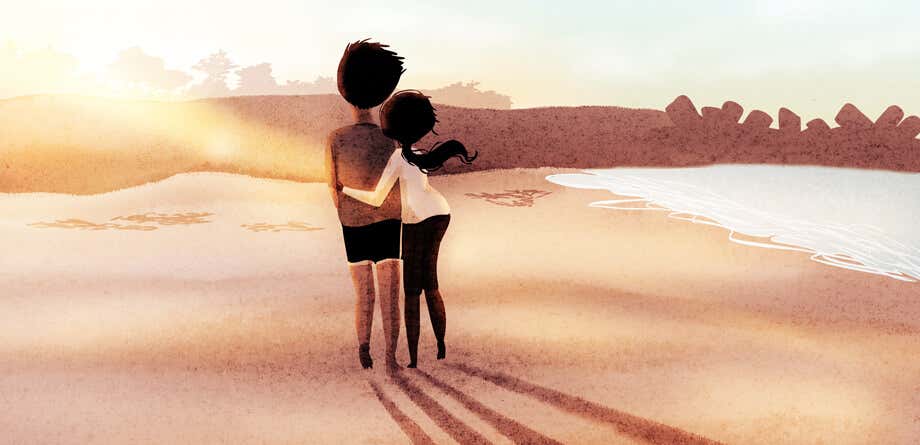 pareja enamorada caminando por playa
