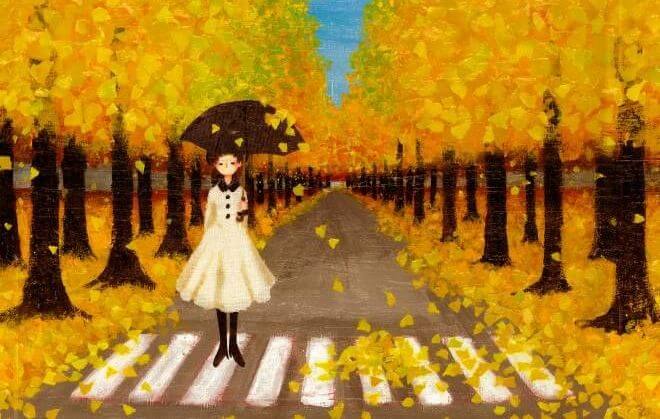 Chica entre árboles amarillos que recuerdan el momento del otoño