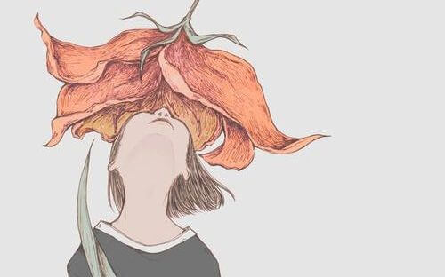 Chica oliendo una flor