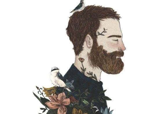 Hombre con barba y pájaro en la cabeza