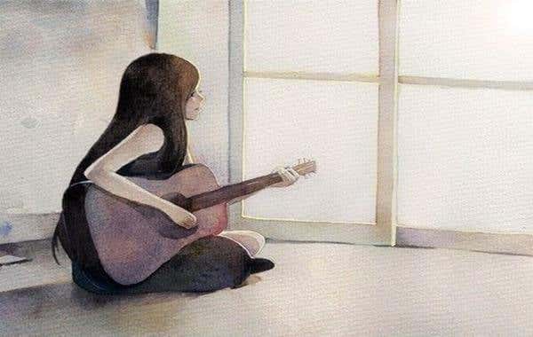 mujer con guitarra sentada en el suelo