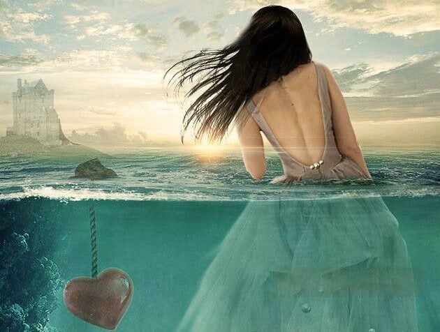 mujer en el agua al lado de un corazón sumergido representado el yo no te importo