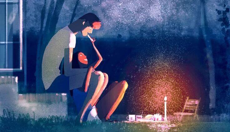 pareja cenando en un jardín con velas