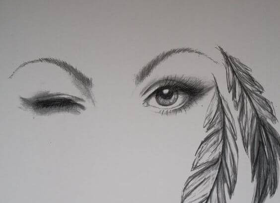 rostro de mujer con pluma a un lado