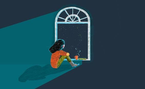 Chica mirando por la ventana