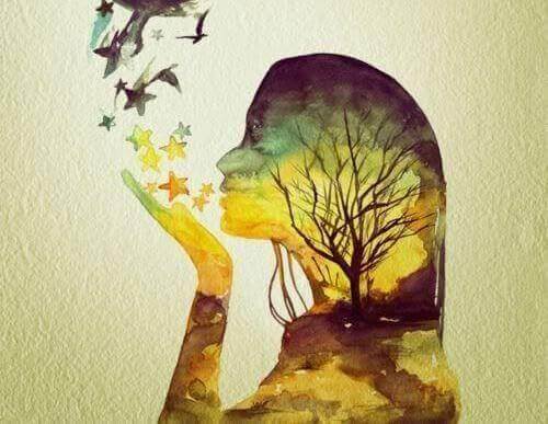 Mujer soplando estrellas