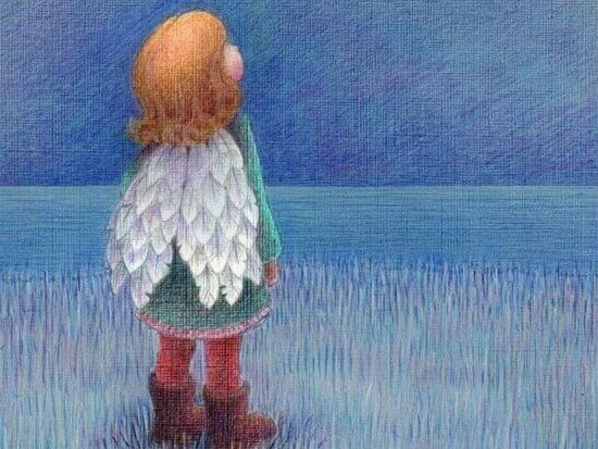 Niño con alas mirando el cielo
