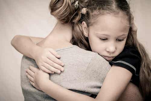 girl hugging mother