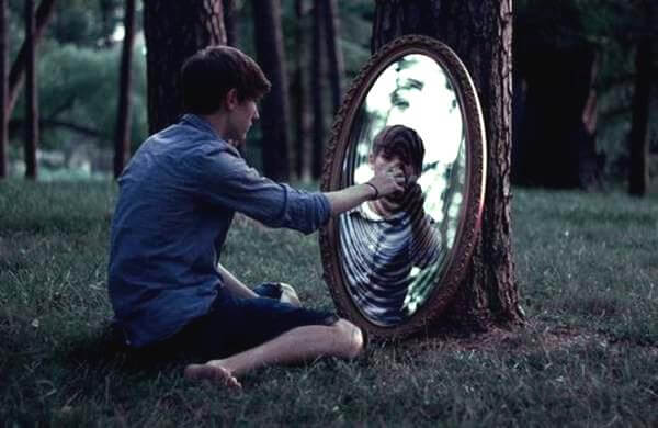 boy looking in mirror