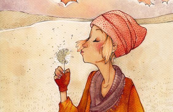 woman blowing dandelion