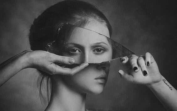 reflection of eyes in broken mirror