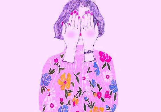 girl hiding behind hands