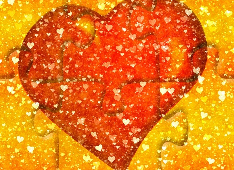 A red heart on puzzle pieces.