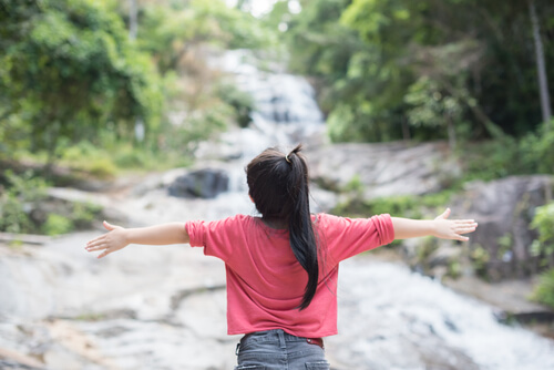 girl with arms wide